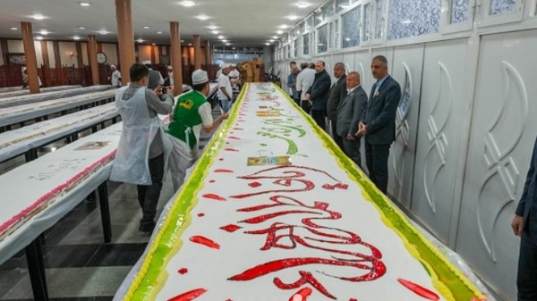 کیک ۲۰۰ متری میلاد امام جواد(ع) در کاظمین+عکس